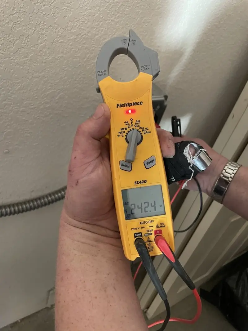 Voltage testing with clamp meter during Aluminum Wiring Replacement in Manchester